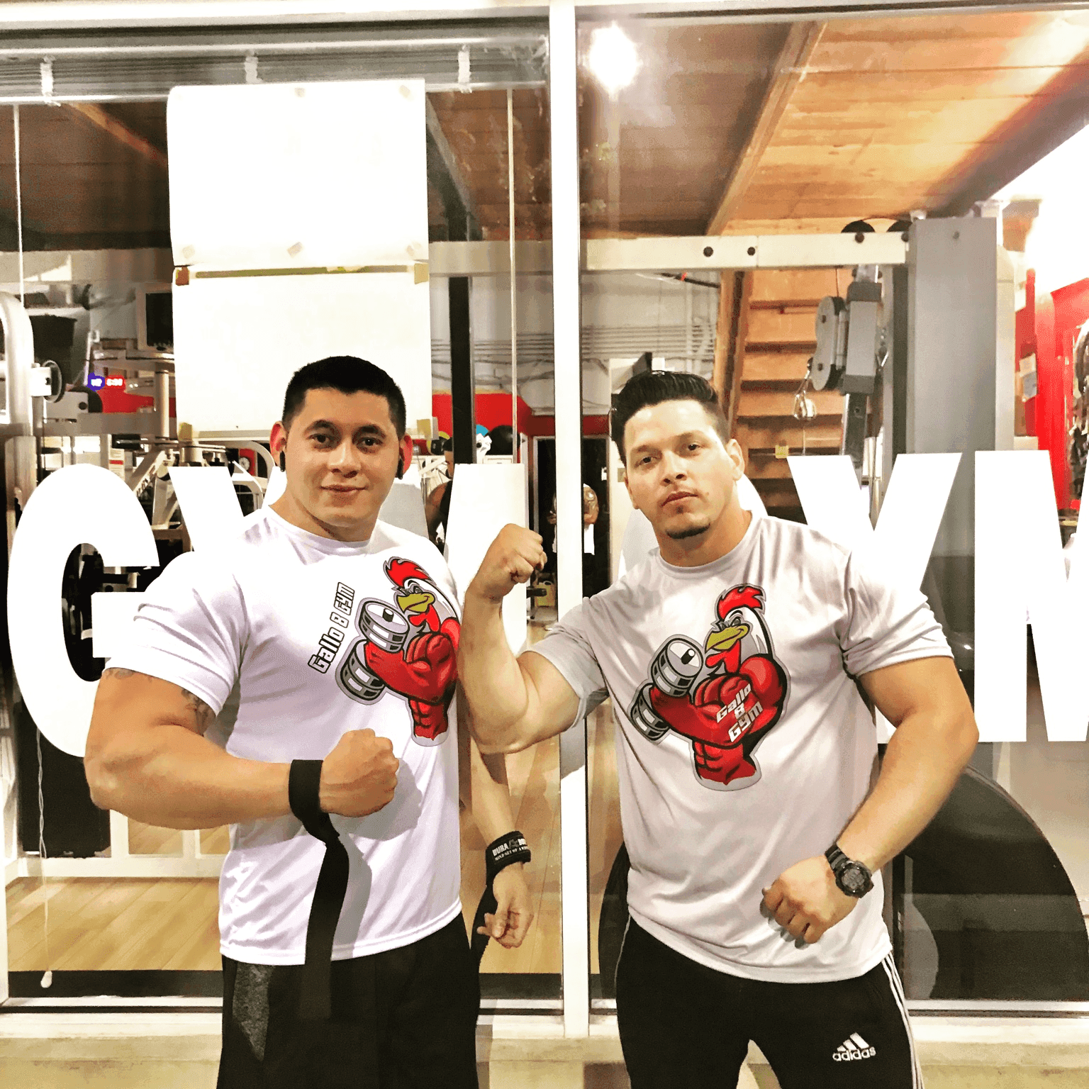 Two Gallo 8 Gym members flexing in branded shirts in Little Havana Miami