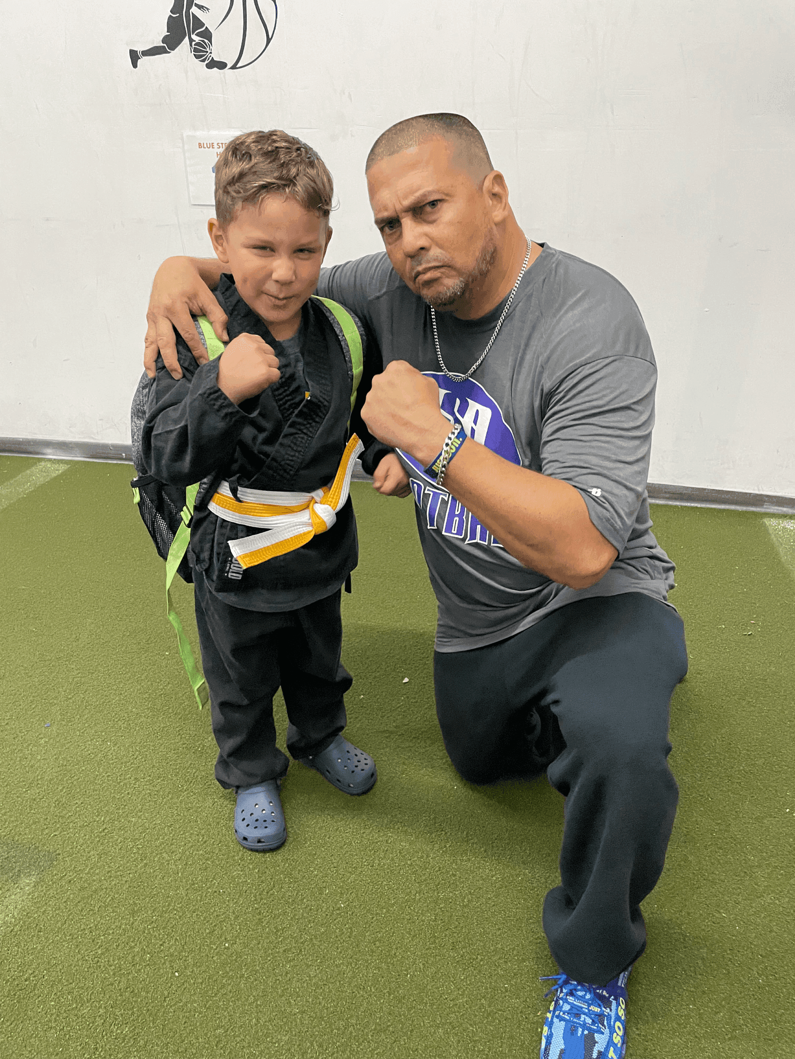 Young martial arts student with coach at Gallo 8 Gym Little Havana